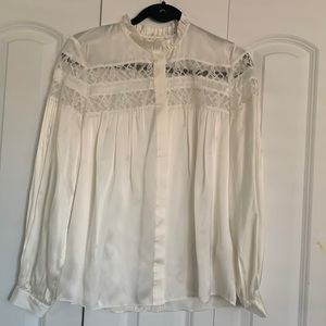 Cream colored, lacy silk blouse